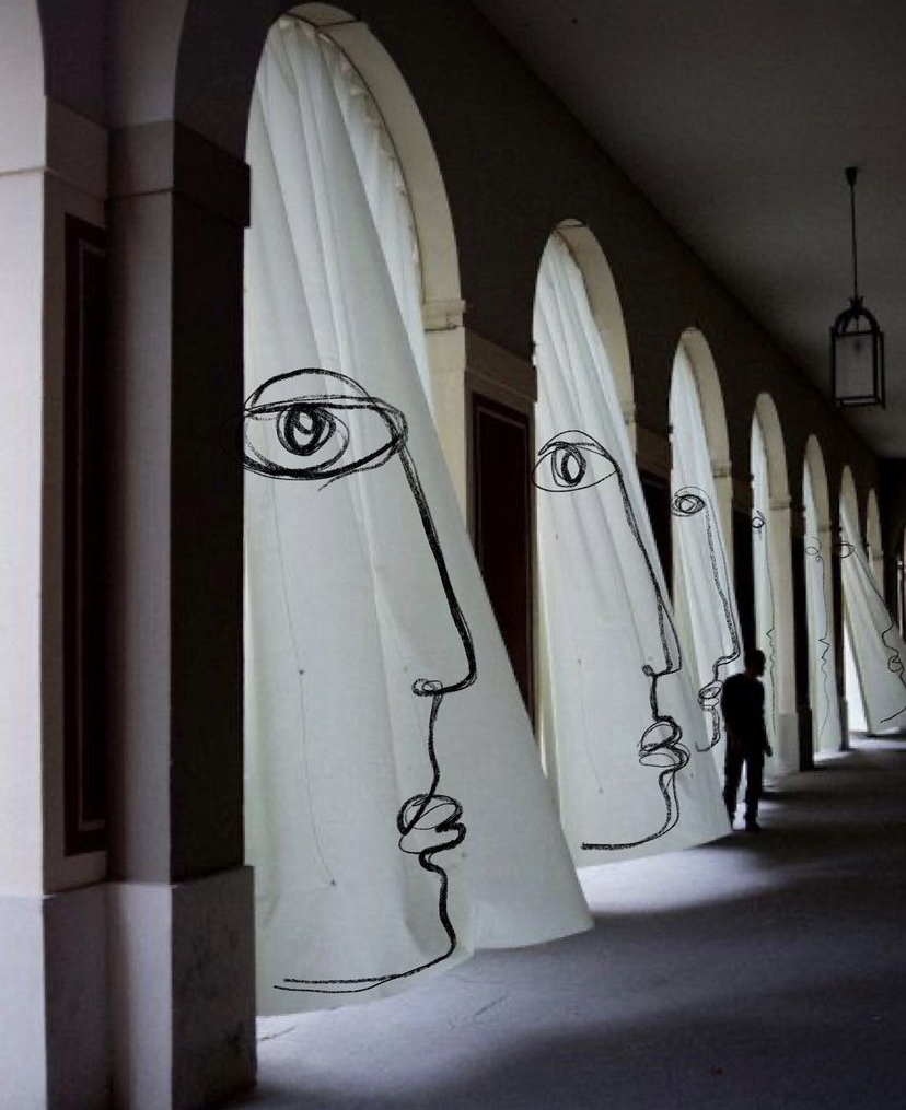 Faces formed on curtains in a corridor